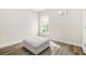 Bright bedroom with a window offering natural light and neutral decor at 5895 Springbox Dr, Suwanee, GA 30024