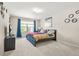 Bedroom featuring a large window with blue curtains, a queen-sized bed and carpeted floors at 5895 Springbox Dr, Suwanee, GA 30024