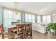 Bright dining area featuring a table for six and modern lighting at 5895 Springbox Dr, Suwanee, GA 30024