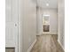 Hallway leading to a bathroom, showcasing the home's layout and design at 5895 Springbox Dr, Suwanee, GA 30024