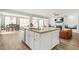 Spacious kitchen island with granite countertops and stainless steel appliances at 5895 Springbox Dr, Suwanee, GA 30024