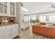 Open concept kitchen with granite counters, cabinetry, and living area at 5895 Springbox Dr, Suwanee, GA 30024