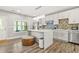 Kitchen with an island, stainless steel appliances, and modern cabinetry at 5895 Springbox Dr, Suwanee, GA 30024