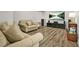 Comfortable living room features hardwood flooring, neutral paint, and updated decor at 5895 Springbox Dr, Suwanee, GA 30024