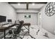 Bright office boasts marble-look floors, recessed lighting, and a large desk at 5895 Springbox Dr, Suwanee, GA 30024