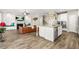 Open floor plan featuring a modern kitchen, living room and fireplace at 5895 Springbox Dr, Suwanee, GA 30024