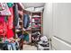 Walk-in closet with custom shelves and rods provides ample storage space at 5895 Springbox Dr, Suwanee, GA 30024