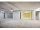 This basement has carpeted floors and exposed brick walls at 175 Oak Manor, Fayetteville, GA 30214