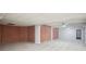 This basement has carpeted floors and exposed brick walls at 175 Oak Manor, Fayetteville, GA 30214