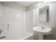 Bright bathroom featuring a white tub, shower, and pedestal sink at 175 Oak Manor, Fayetteville, GA 30214