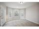 This bonus room has carpeted floors and multiple windows plus french doors at 175 Oak Manor, Fayetteville, GA 30214