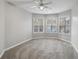 This bonus room features a ceiling fan with lighting and multiple windows at 175 Oak Manor, Fayetteville, GA 30214