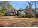 Well-manicured front yard of a charming home with a combination of brick and stucco exterior at 175 Oak Manor, Fayetteville, GA 30214