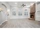 Bright living room with high ceilings, a stone fireplace, large windows, and hardwood floors at 175 Oak Manor, Fayetteville, GA 30214