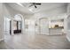 Spacious open-concept layout with a grand entrance, modern lighting, and hardwood flooring at 175 Oak Manor, Fayetteville, GA 30214