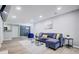 Open-concept living room with a cozy sofa, contemporary decor, and an adjacent dining area at 24317 Plantation Ne Dr, Atlanta, GA 30324