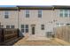 Backyard featuring a fenced-in yard with a door to a patio at 2721 Kemp Sw Ct, Conyers, GA 30094