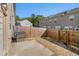 Fenced backyard with a concrete patio and an adjacent low-maintenance gravel area at 2721 Kemp Sw Ct, Conyers, GA 30094
