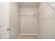 A small walk in closet with wire shelving and carpeted floor at 2721 Kemp Sw Ct, Conyers, GA 30094
