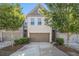 Charming townhome featuring a two-car garage and a welcoming brick facade surrounded by lush trees at 2721 Kemp Sw Ct, Conyers, GA 30094