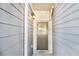 Close-up of front door with sidelight and sidelight, showing address under decorative light fixture at 2721 Kemp Sw Ct, Conyers, GA 30094