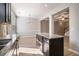 Open floor plan with modern kitchen island, granite countertops, and stainless sink at 2721 Kemp Sw Ct, Conyers, GA 30094