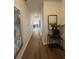 Long hallway leads to living areas, adorned with elegant decor and featuring modern flooring throughout at 4258 Sw Notting Hill Dr # 32, Atlanta, GA 30331
