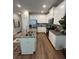 Well-lit kitchen features white cabinets, stainless steel appliances, and granite countertops on the island at 4258 Sw Notting Hill Dr # 32, Atlanta, GA 30331