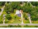 An expansive estate featuring manicured lawns, extensive garages, and mature trees at 84 Ledbetter Rd, Villa Rica, GA 30180