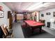 Basement featuring a pool table, gray carpeting, and painted walls at 84 Ledbetter Rd, Villa Rica, GA 30180