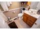 This bathroom features a vanity with storage, a mirror, a toilet, and a shower at 84 Ledbetter Rd, Villa Rica, GA 30180
