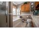Bright bathroom features a soaking tub under the window, a vanity, and a walk-in shower at 84 Ledbetter Rd, Villa Rica, GA 30180