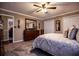 Bedroom showcasing a bed with decorative pillows, closet doors, and stylish decor at 84 Ledbetter Rd, Villa Rica, GA 30180