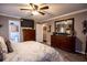 Spacious bedroom with wood furniture and an en-suite bathroom at 84 Ledbetter Rd, Villa Rica, GA 30180