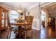 Dining room features a chandelier, wood table, and view into a living room at 84 Ledbetter Rd, Villa Rica, GA 30180
