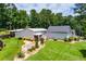 Two-story home with a metal roof, well-manicured lawn and landscaping at 84 Ledbetter Rd, Villa Rica, GA 30180