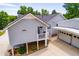Charming home featuring a side entry garage, complemented by lush landscaping at 84 Ledbetter Rd, Villa Rica, GA 30180