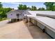 Two-story home with a metal roof, large driveway, and spacious three-car garage at 84 Ledbetter Rd, Villa Rica, GA 30180