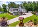 Wide view of a charming home with a well-manicured lawn and landscaped garden beds at 84 Ledbetter Rd, Villa Rica, GA 30180