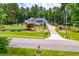 Inviting home with a large yard, a front porch, and attractive landscaping at 84 Ledbetter Rd, Villa Rica, GA 30180
