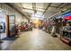 Ample storage garage with well-organized shelves, tool and equipment, and clear workspace at 84 Ledbetter Rd, Villa Rica, GA 30180