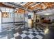 A partial view of the expansive garage with checkered flooring and a pool table at 84 Ledbetter Rd, Villa Rica, GA 30180