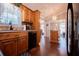 Kitchen with wood cabinets and a breakfast bar with view to a dining room at 84 Ledbetter Rd, Villa Rica, GA 30180