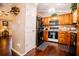 Warm kitchen with wood cabinetry and stainless steel appliances at 84 Ledbetter Rd, Villa Rica, GA 30180
