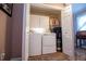 A laundry room features a washer, dryer, storage cabinet, and closet space at 84 Ledbetter Rd, Villa Rica, GA 30180