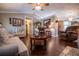 Spacious living room featuring dark wood floors, ceiling fan, and neutral color palette at 84 Ledbetter Rd, Villa Rica, GA 30180