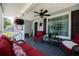 Inviting porch with comfortable seating, ceiling fan, and stylish decor at 84 Ledbetter Rd, Villa Rica, GA 30180