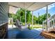 Inviting porch features a swing with great views of the front yard and street at 84 Ledbetter Rd, Villa Rica, GA 30180