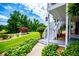 Side view of staircase and porch entrance surrounded by lush green foliage and manicured lawn at 84 Ledbetter Rd, Villa Rica, GA 30180