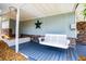 Relaxing front porch with a porch swing, stone accents and a star decoration at 84 Ledbetter Rd, Villa Rica, GA 30180
